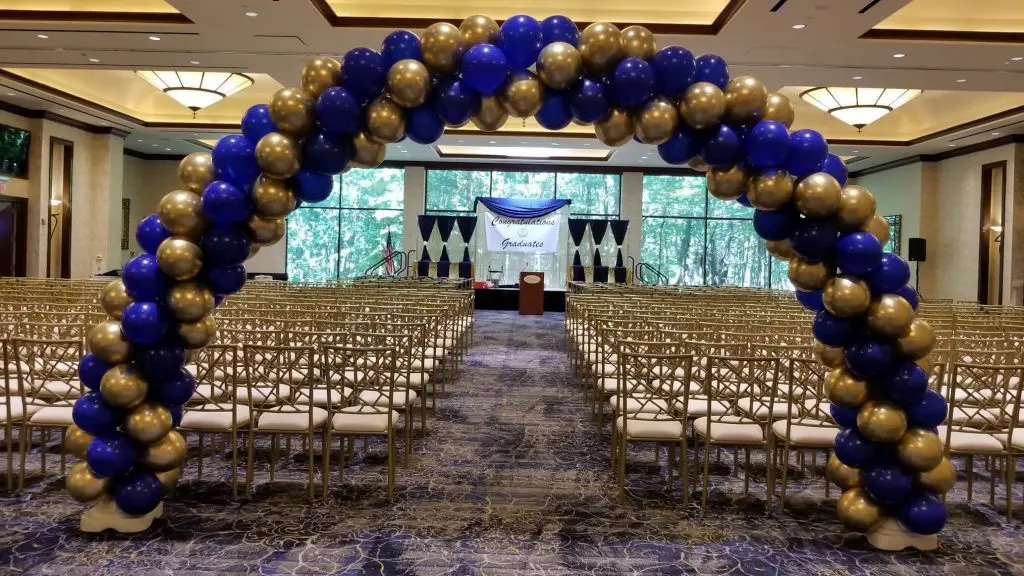 A stunning garland of Quartz Purple and Gold latex balloons twisted together, perfect for adding a pop of color and elegance to an anniversary party in New York.