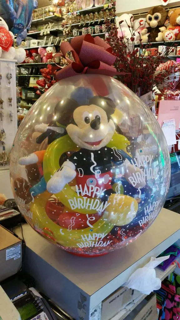 Balloons Lane Balloon delivery Brooklyn in using colors Yellow Red White and Blue Mickey mouse gift in the round clear balloon Bouquet for Event Party