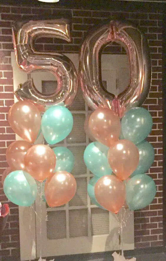50th rose gold balloons column with mint green and rose gold latex balloons