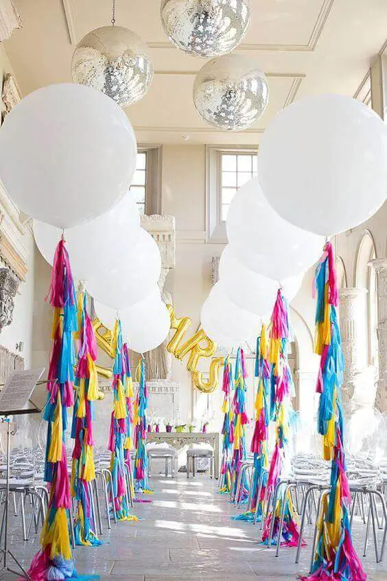 organic white round balloons on the colorful long tassel