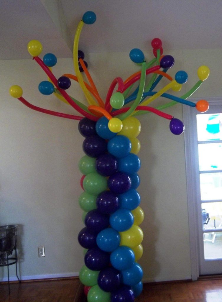 Column of navy, green, blue, yellow, red, purple, and orange latex balloons delivered by Balloons Lane in Staten Island