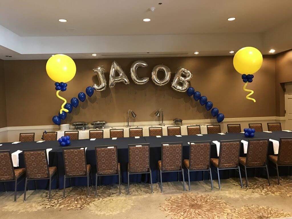 Balloons Lane Balloon delivery in Staten Island use colors Yellow and Navy Blue latex balloons With Silver Letter JACOB Arch for an Event Party