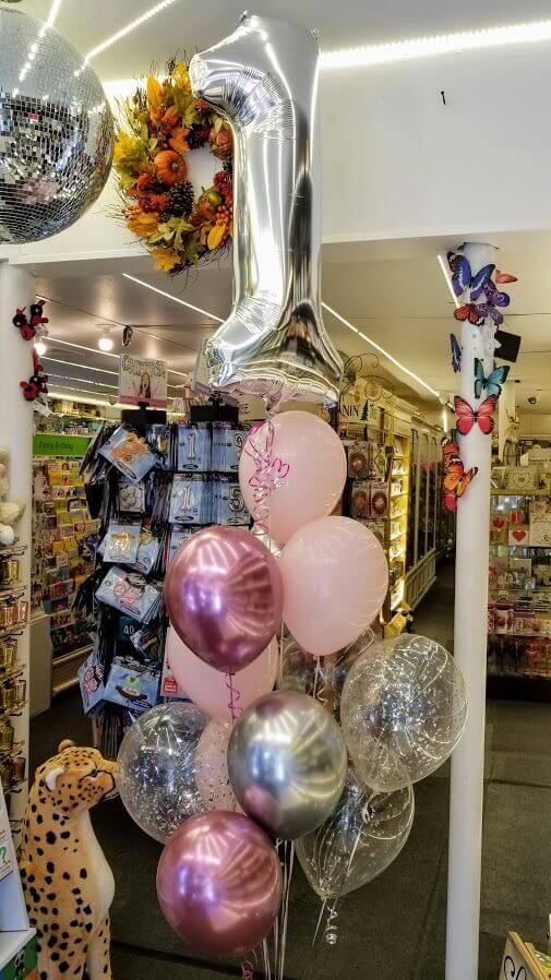 baby 1st mylar silver balloons with a dark pink light pink clear balloon with silver confetti and pink chrome