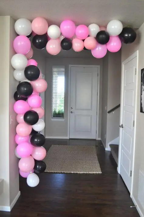 A stunning Door Deco Arch made of Pink, Black, White, Silver, and Blush latex balloons, perfect for adding a celebratory touch to an anniversary party in Brooklyn, delivered by Balloons Lane balloon delivery.