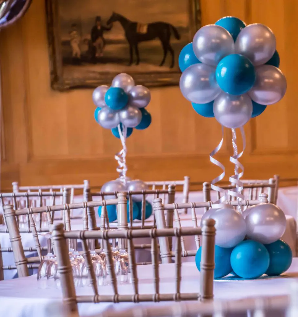 Tropical teal and gray confetti balloon column for a birthday celebration in Brooklyn by Balloons Lane Balloon Delivery