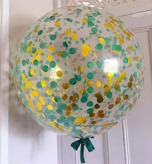 A stunning selection of confetti balloons in gold and emerald green, perfect for adding a touch of elegance to your occasion party decor. Order online and have them delivered right to your door