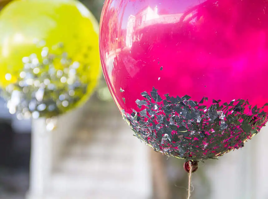 Yellow, Silver, and Magenta confetti balloons for an anniversary party, with pink and gold confetti balloons.