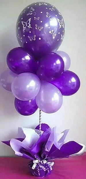 A lavender and purple big balloon bouquet centerpiece by Balloons Lane in Brooklyn is a lovely addition to any event. The soft shades of lavender and purple create a calming and elegant atmosphere