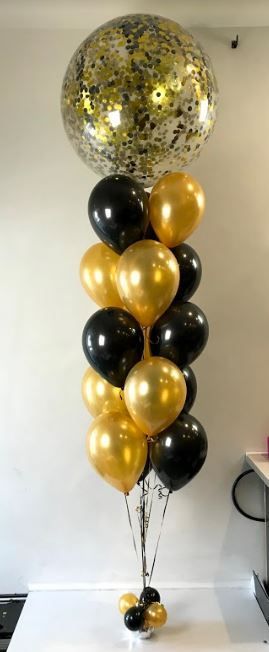 Balloons Lane black and gold confetti balloon column with mini balloons at the bottom for birthday or anniversary in Brooklyn