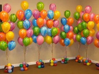 Marble balloons in green , orange, blue, and pink balloon centerpiece by Balloons Lane