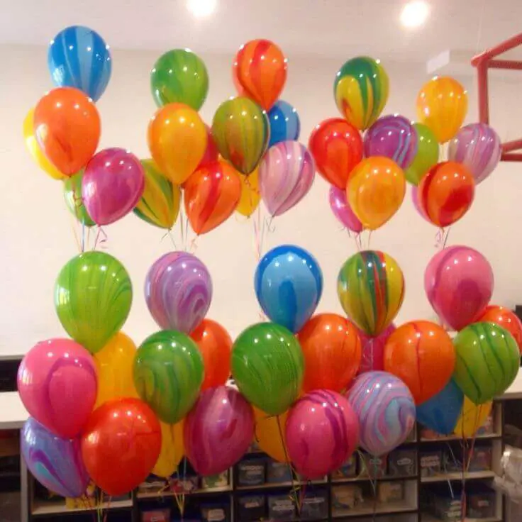 Pink, yellow, green, and azure marble latex balloon column for a party in NJ by Balloons Lane.