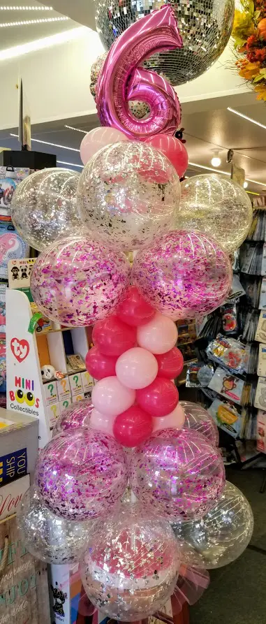 Magenta, Pink, Wild Berry and Silver balloons, with a number 6 confetti balloon for party decorations.