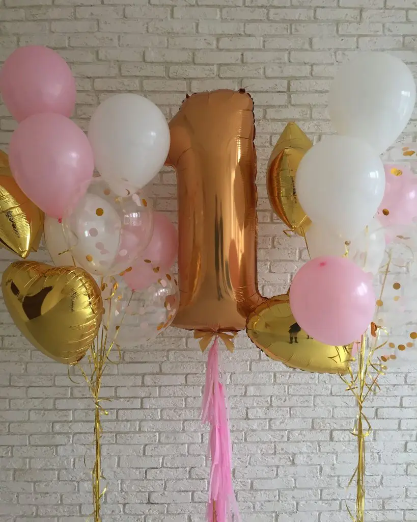 1st birthday balloons with big number 1 in gold and clear confetti with white pink latex balloons