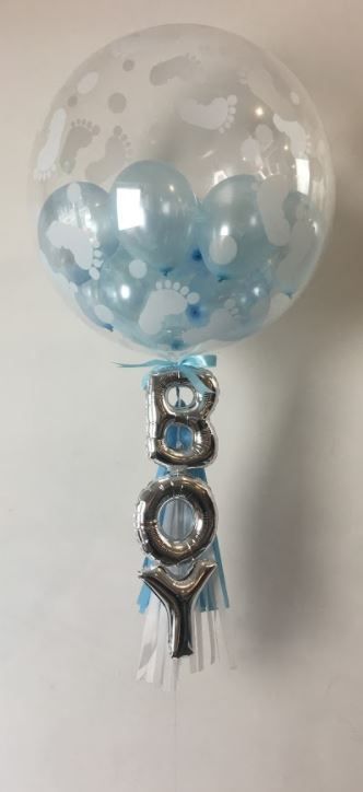 its a boy balloon with silver letters clear big round with tassel
