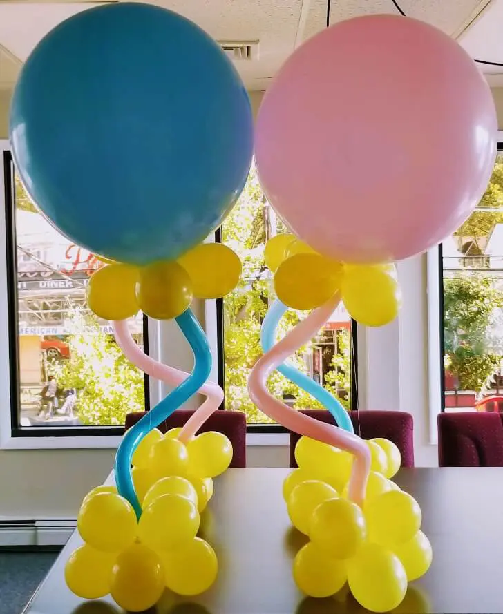 Baby shower balloons in light pink, light blue, and yellow colors