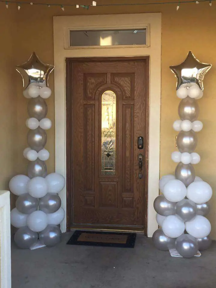 Balloons Lane Balloon delivery Soho in use colors silver and white with Mylar silver star balloons for birthday column