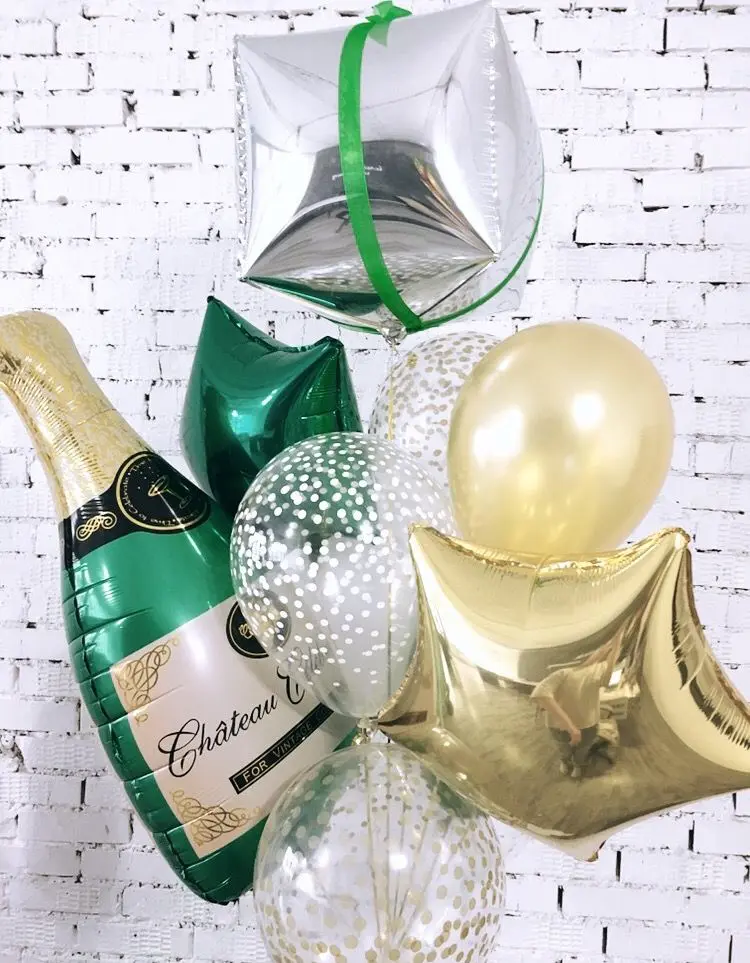 A celebratory and festive bouquet of big champagne bottle Mylar and latex balloons arranged in a decorative manner. The balloons create a playful and joyous atmosphere for any type of celebration.