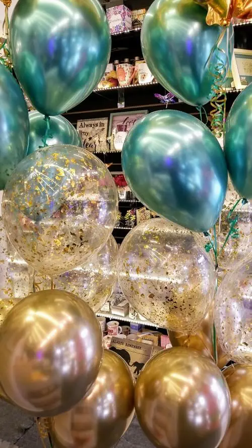 chrome green and a gold balloon with clear gold confetti bridal shower balloons