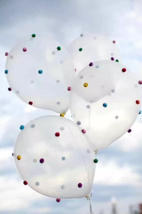 clear latex balloons with colorful pom pom