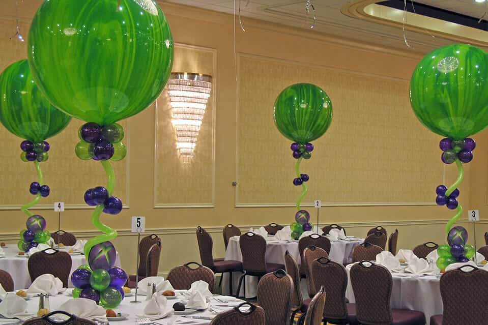 A group of colorful balloons in various sizes arranged in a festive decoration for a prom or graduation party in NYC.