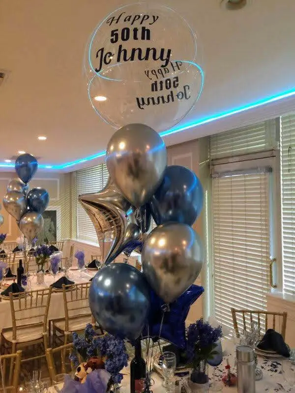 A stylish and elegant decoration for a 50th birthday or baby girl's first anniversary celebration, featuring a mix of Chrome® Dark Blue, Chrome Silver, and Chrome Blue star-shaped latex balloons arranged in a garland.