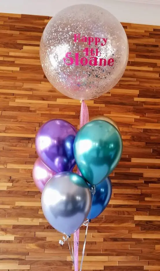 Chrome balloons in various colors with round silver confetti and a happy birthday message.