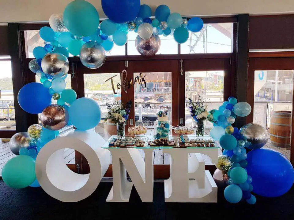 baby boy first birthday Balloons Half Arch in blue and silver organic balloon garland.The colors complement each other beautifully, creating an eye-catching display that's perfect for any celebration.