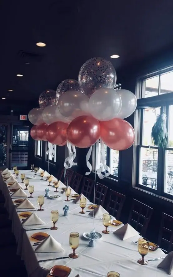 White and rose gold christening balloons AND air centerpiece for your formal get together
