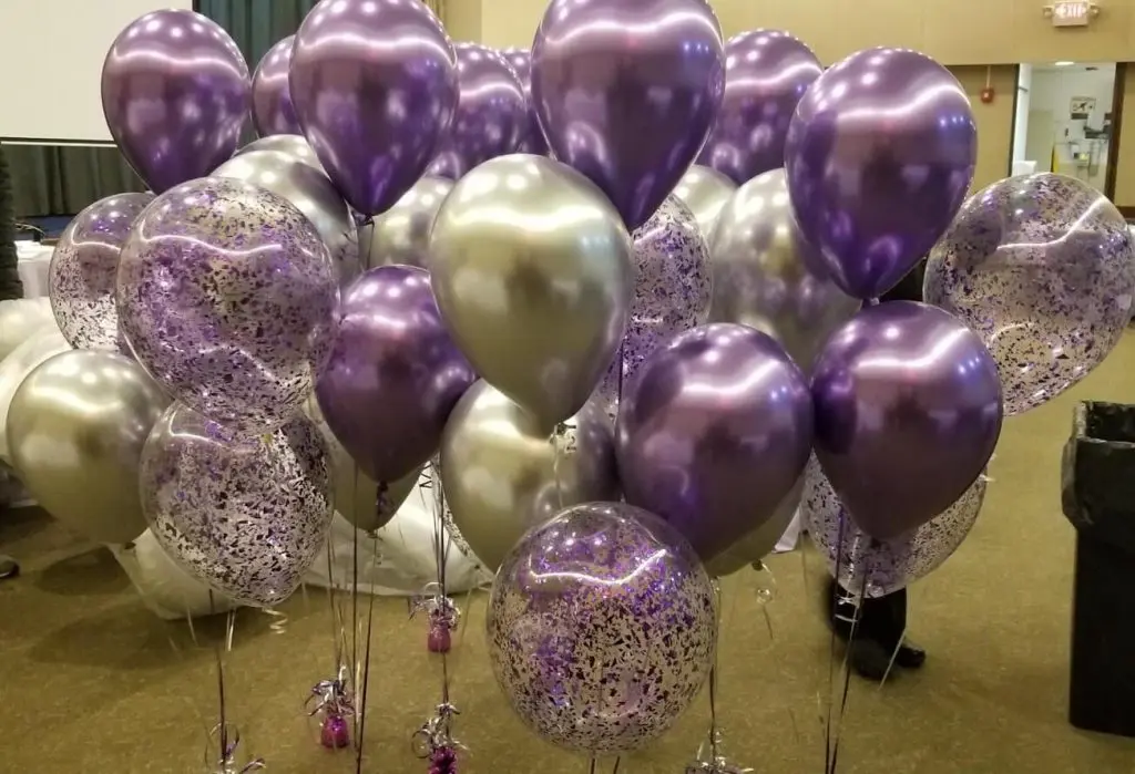 Add a touch of elegance to your occasion with these stunning purple and silver balloon centerpieces by Balloons Lane.