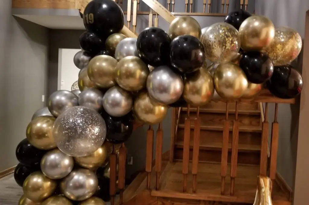 Balloons Lane Balloon delivery in NJ use colors gold silver and black decorations for arch with silver and gold confetti balloons