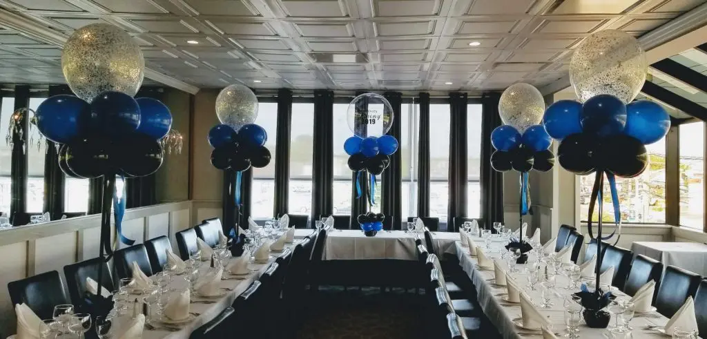 Celebrate your graduation in style with these elegant black, blue, and white balloon centerpieces by Balloons Lane.