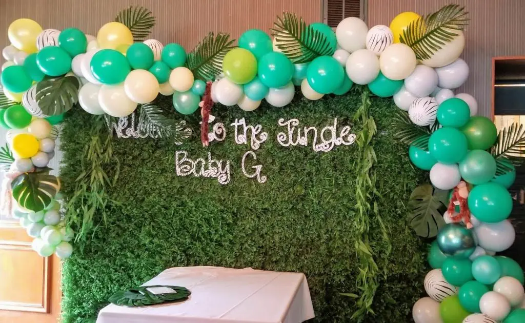 Balloons Lane in Staten Island Presents jungle theme balloons in Yellow Emerald Green Pearl White green and white latex balloons arch