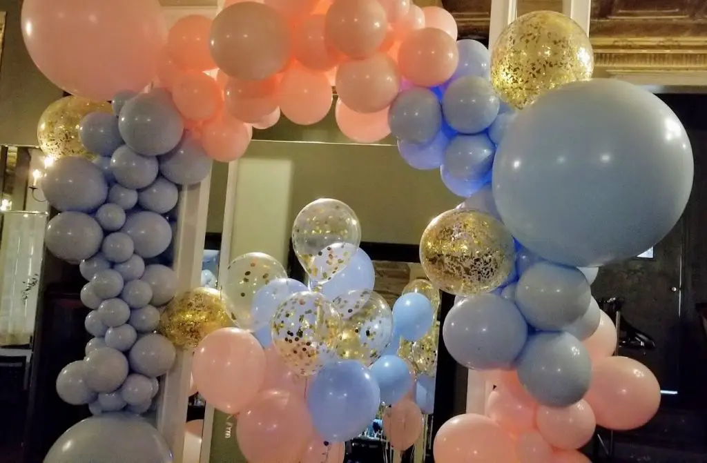 Balloons Lane in NJ presents light pink light blue latex balloons garland arch. The colors complement each other beautifully, creating an eye-catching display that's perfect for any celebration.