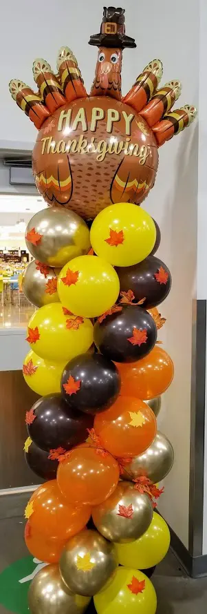 Balloon column in orange, brown, yellow, blue, and gold latex balloons by Balloons Lane in Brooklyn for thanksgiving