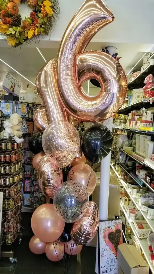 Rose gold ,confetti and black balloons number 16 big balloons