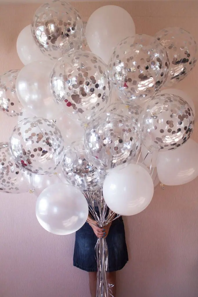 Balloons Lane in Staten Island offers silver and white confetti balloons for confetti-filled latex balloons.