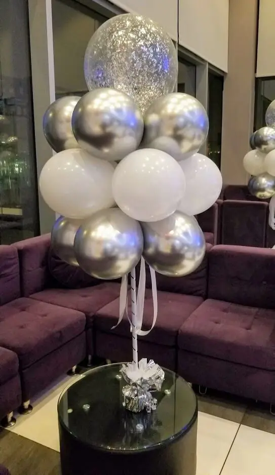 Column of silver chrome latex balloons with clear silver confetti latex balloons for anniversary decoration delivered by Balloons Lane in NJ