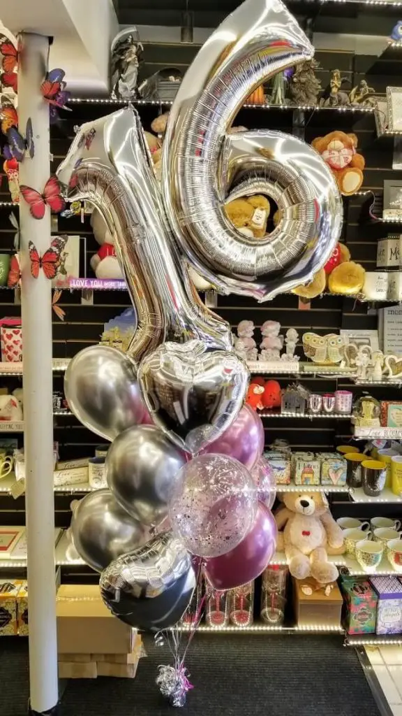 Silver Chrome Purple balloons with sweet 16 balloons number in silver with latex balloons to celebrate milestone birthday