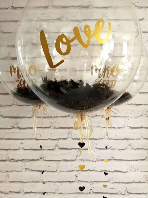 Balloons Lane use colors Gold and Black balloons with valentine balloons clear confetti filled balloons