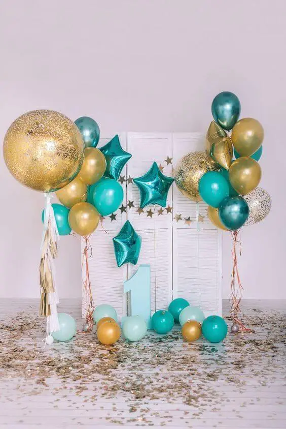 Balloons Lane in NYC creates eye-catching decorations using a mix of mint green and chrome gold balloons, along with teal latex and blue and gold mylar balloons. These decorations are perfect for adding a pop of color and fun to any event