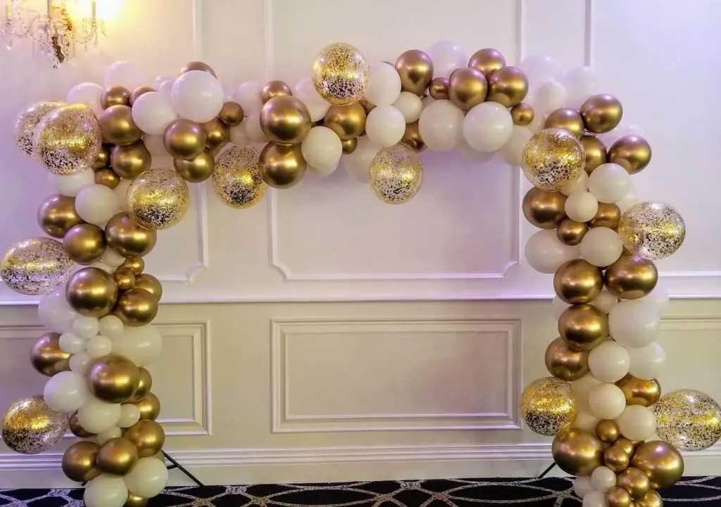 A balloon arch frame created by Balloons Lane Balloon in NJ, featuring silver and navy blue balloons as decorations. The colors are classic and timeless, creating a sophisticated and refined atmosphere.