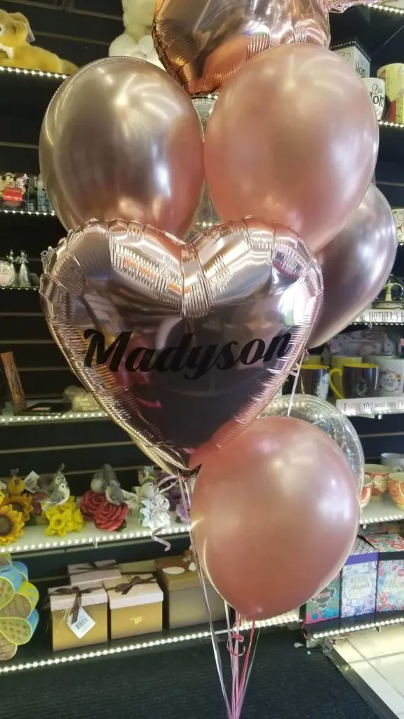 Balloon Lane uses the colors A Valentine's Day balloon decoration in NYC, featuring bouquets of rose gold and chrome copper latex, mylar, and confetti balloons, with big chrome copper balloons