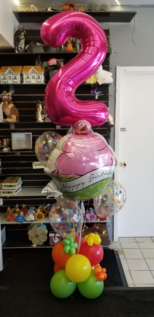 Balloons Lane Balloon delivery Soho in using colors Green Yellow Orange Red Pink and Magenta balloons With Number balloons 1 in Magenta Bouquet for one year old birthday