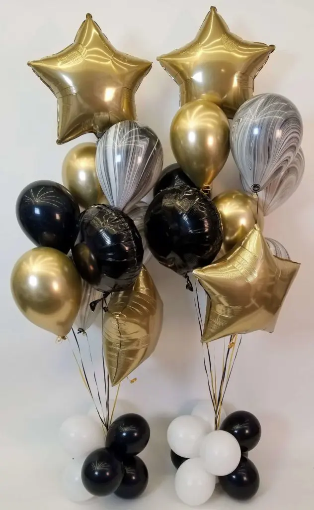 White, black, and chrome gold balloon decorations with star balloons in a chrome gold balloon bouquet in New Jersey.