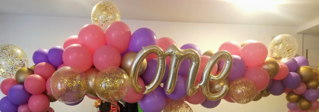 Balloons Lane Balloon delivery Manhattan in using colors Pink Purple and Chrome Gold balloons With Number Balloons one in Chrome Gold Centerpiece for 1st birthday
