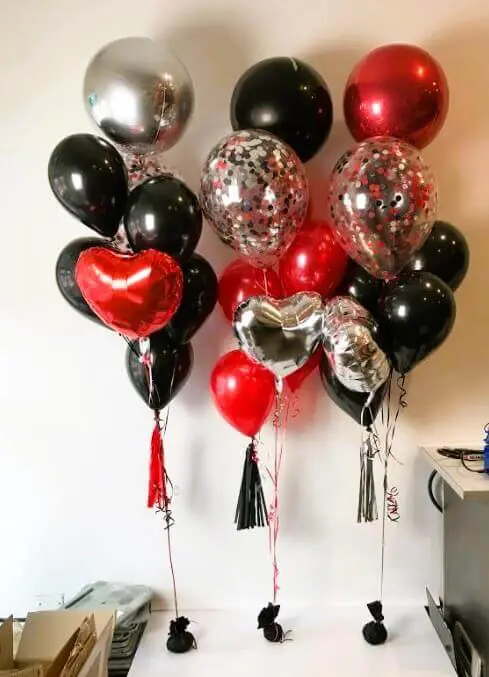Red, black, and silver balloon bouquet with tassels and Orbz balloons for Valentine's Day balloons in NYC.