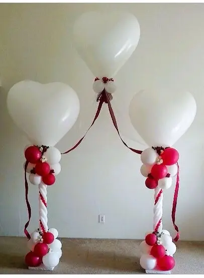 Balloons Delivery in New Jersey uses colors Chrome white and chrome red balloon column with floating heart latex balloons for Valentine's Day decor.