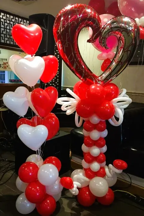 Balloons lane in Brooklyn uses colors red white Balloon column and bouquet set in chrome white, chrome red, and chrome gold with mylar heart and latex balloons for Valentine's Day decor.