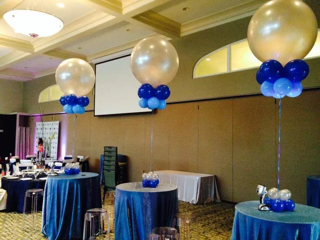 Blue, white, gray, and dark balloons with a large gold balloon, available for delivery in NYC by Balloons-Lane
