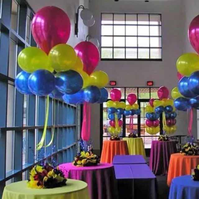 A bouquet of shocking pink, blue, and yellow chrome balloons, available for delivery in NYC by Balloons Lane Balloon